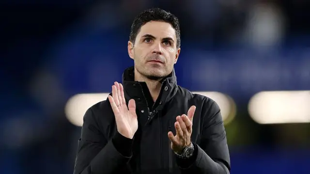 Mikel Arteta applauds Arsenal fans.