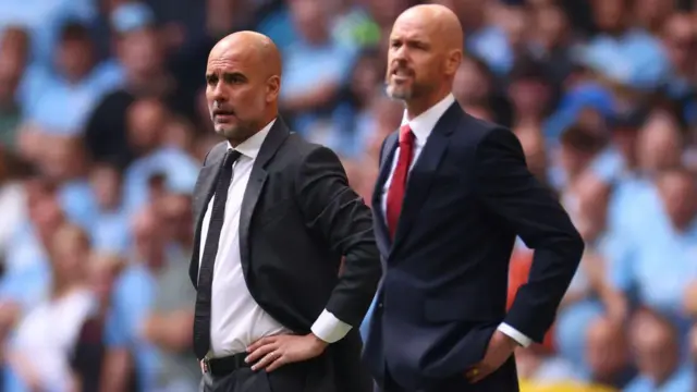 Pep Guardiola and Erik ten Hag stand on the touchline