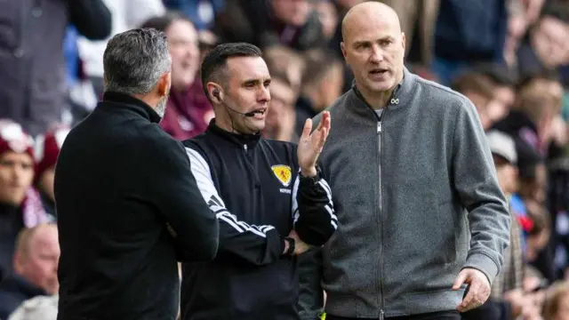 Motherwell manager Jens Berthel Askou talks to the fourth official