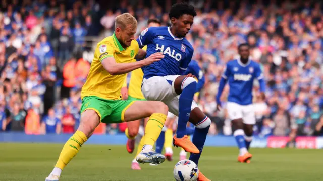 Jaden Philogene of Ipswich Town and Harry Darling of Norwich City contest the ball