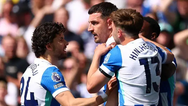 Brighton players celebrating Lewis Dunk's goal
