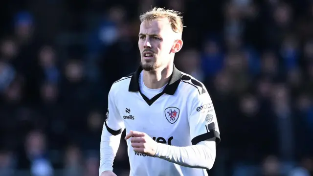 Mark Sykes jogging on the pitch during a match