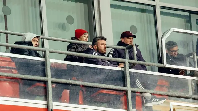 Michael Carrick (centre) went to watch Manchester United's Under-21 side with coaches Jonathan Woodgate (left) and Steve Holland (wearing cap) at Leigh