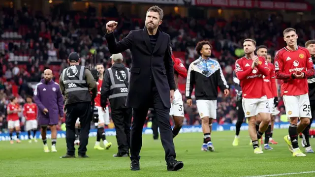 Michael Carrick acknowledges the fans after beating Fulham