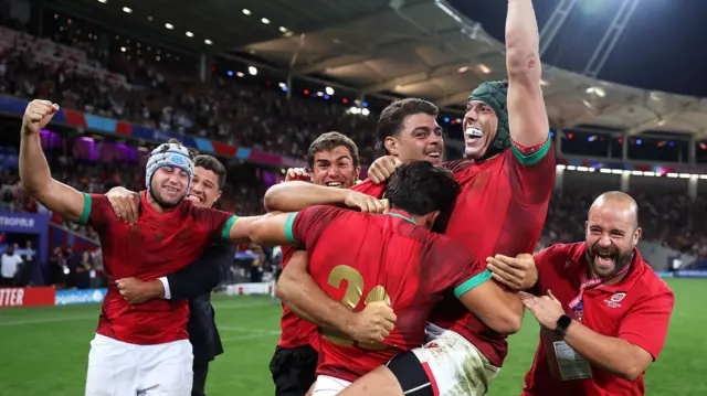 Portugal players celebrate after being Fiji at the 2023 World Cup