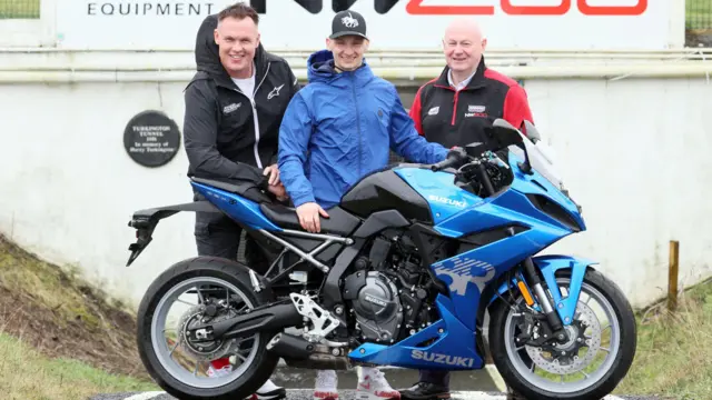 Richard Cooper (centre) flanked by team boss Brad Clarke and NW200 Event Director Mervyn Whyte