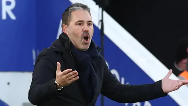 Marti Cifuentes with his arms spread wide as he watches Leicester against Watford earlier this season