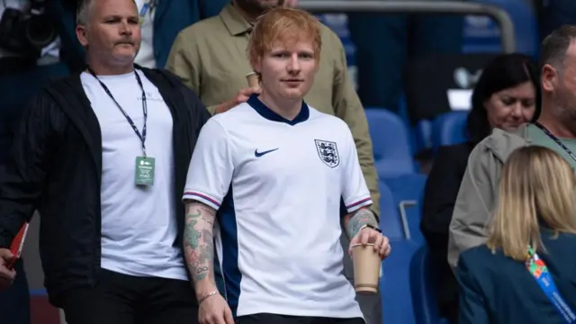 Ed Sheeran in the stands wearing an England shirt