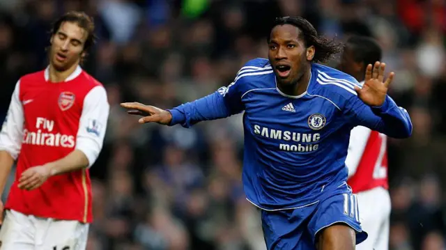Didier Drogba celebrates a goal against Arsenal for Chelsea