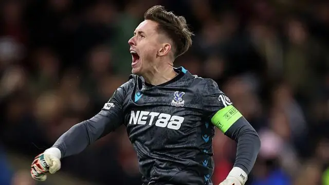 Dean Henderson celebrates a goal scored for Crystal Palace