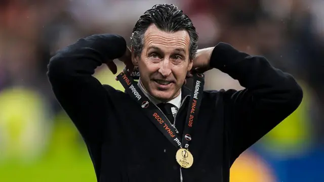Unai Emery, head coach of Aston Villa FC, adjusts his medal during the award ceremony following the Uefa Europa League 2025-26 final football match between SC Freiburg and Aston Villa.