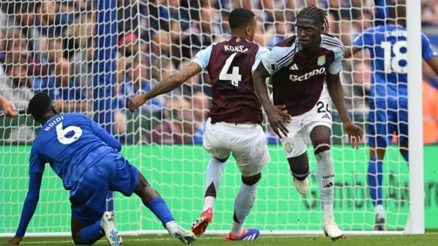 Amadou Onana celebrates opening the scoring against Leicester