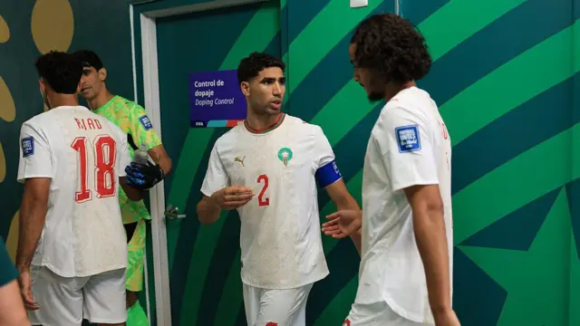 Achraf Hakimi and Ayyoub Bouaddi of Morocco talk in the tunnel