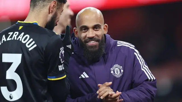 Mbeumo smiles at the camera