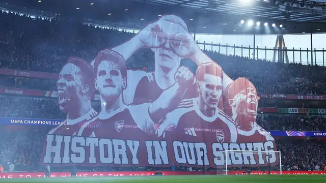 A tifo banner at Emirates Stadium reading 'History in our sights'