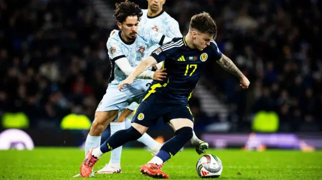 GLASGOW, SCOTLAND - OCTOBER 15: Scotland's Ben Doak and Portugal's Vitinha in action during a UEFA Nations League Group A1 match between Scotland and Portugal at Hampden Park, on October, 15, 2024, in Glasgow, Scotland. (Photo by Craig Williamson / SNS Group)