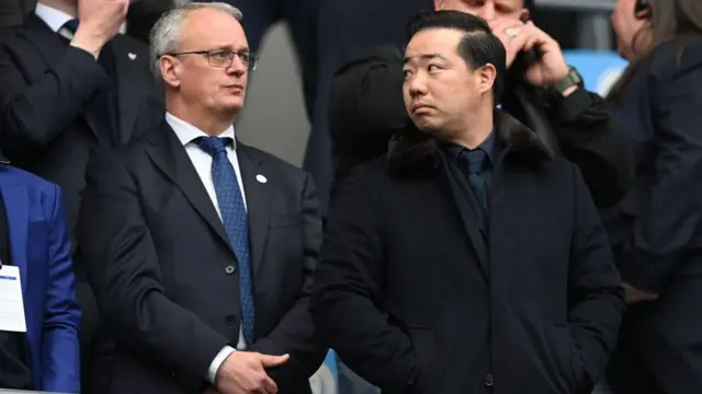 Leicester City director of football Jon Rudkin stands with chairman of Leicester City Aiyawatt Srivaddhanaprabha during the Premier League match between Manchester City and Leicester City at Etihad Stadium on April 15, 2023