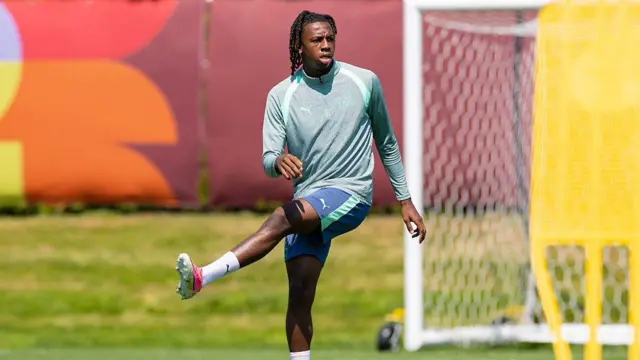 Johan Manzambi stretches during a training session