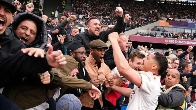 William Saliba of Arsenal celebrates with the fans