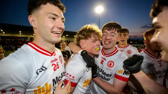 Tyrone players celebrate their win
