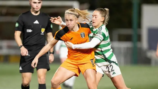 Katie Lockwood (left) is challenged by Lucy Ashworth-Clifford