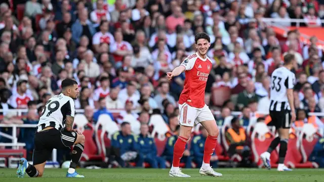 Declan Rice of Arsenal interacts with Bruno Guimaraes of Newcastle United