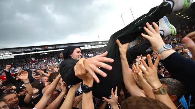 Fabian Hurzeler is held aloft by St Pauli fans