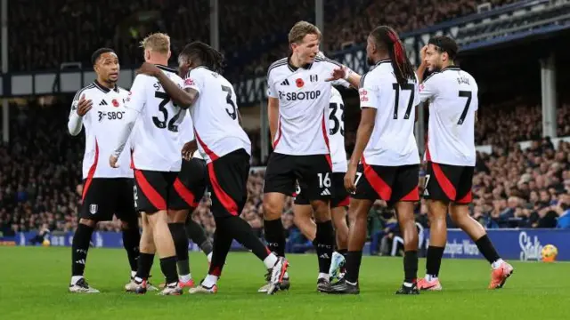 Alex Iwobi of Fulham celebrates his goal with his team-mates during the Premier League match against Everton