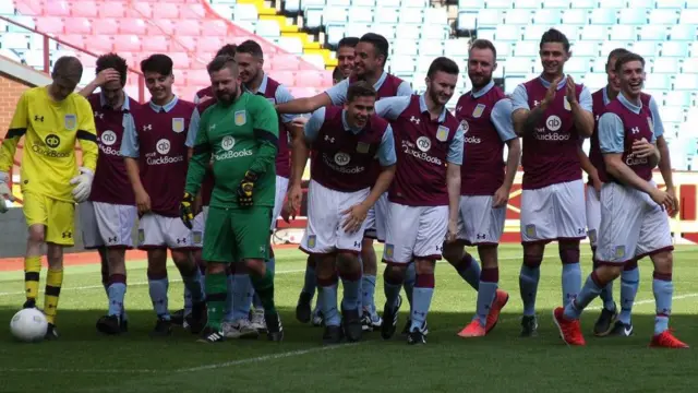 Lewis and his teammates celebrating winning their penalty shootout at Villa Park 