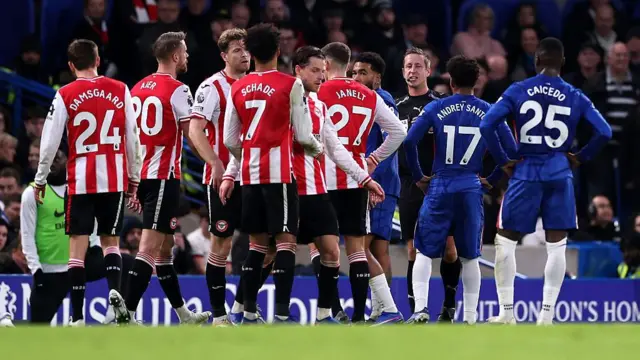 Brentford and Chelsea players clash