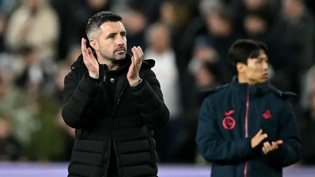 Alan Sheehan applauds fans in one of his final Swansea games