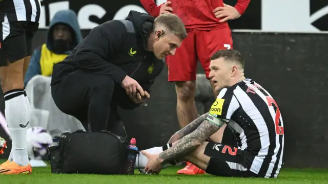 Kieran Trippier looks on before leaving the field with an injury