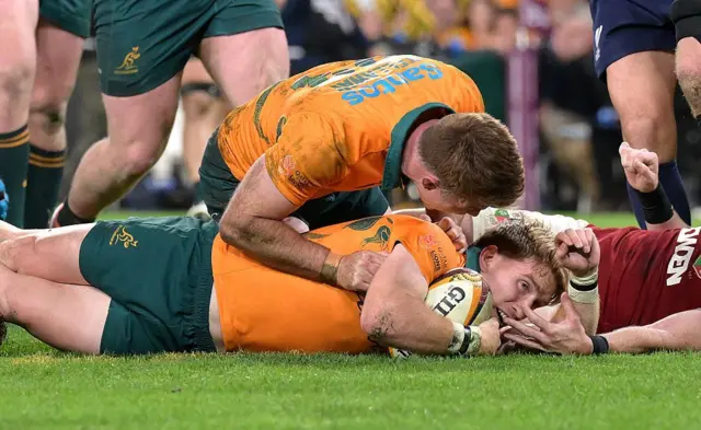ate McDermott of the Wallabies scores a try.