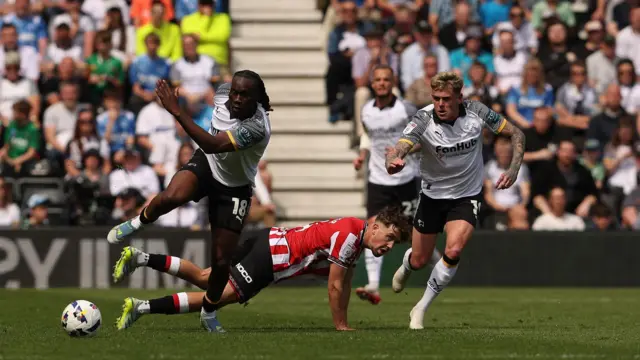 Derby County's David Ozoh is tackled by Sheffield United's Oliver Arblaster