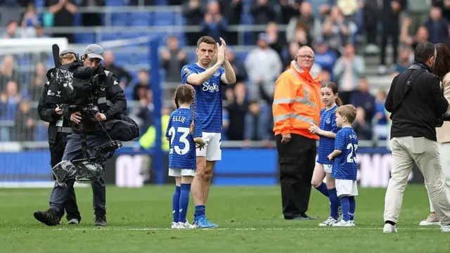 Seamus Coleman of Everton acknowlegdes the fans with his family.