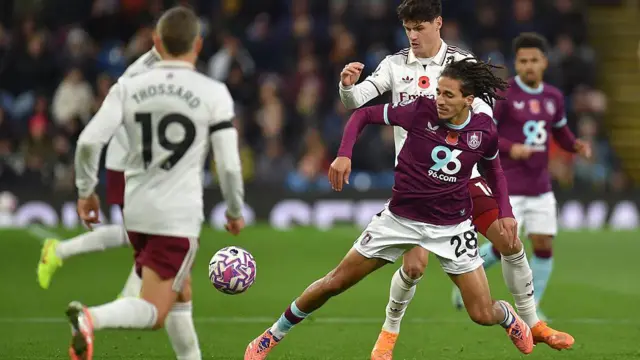 Burnley's Hannibal Mejbri vies for the ball with Arsenal's Christian Norgaard