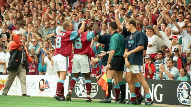 Dwight Yorke and Mark Draper celebrate a goal during Aston Villa's 3 -1 win over Manchester United at Villa Park on 19 August 1995
