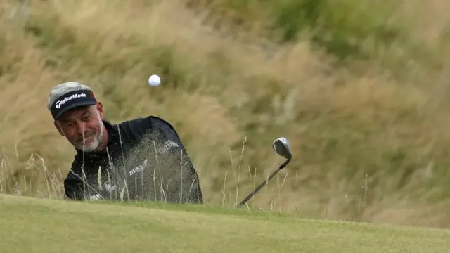 Darren Clarke plays a bunker shot