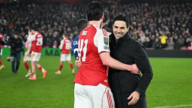 Mikel Arteta and Declan Rice celebrate together on the pitch