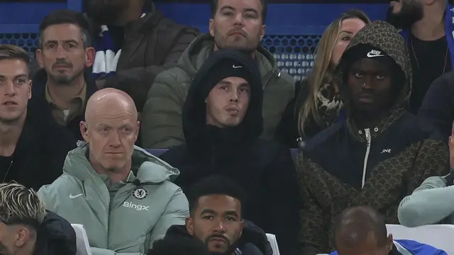 Cole Palmer watches Chelsea play from the stands