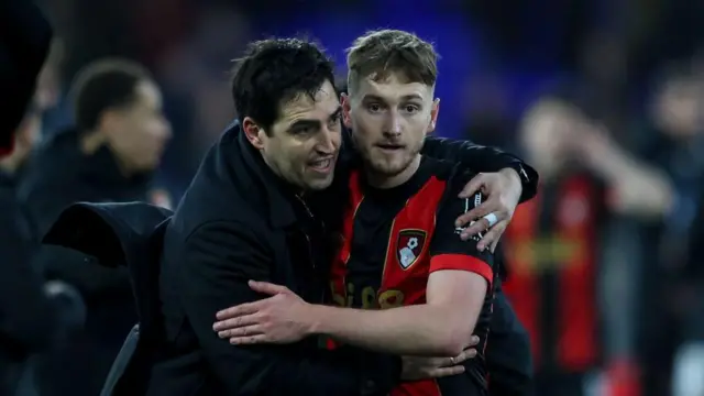 Andoni Iraola hugs a Bournemouth player