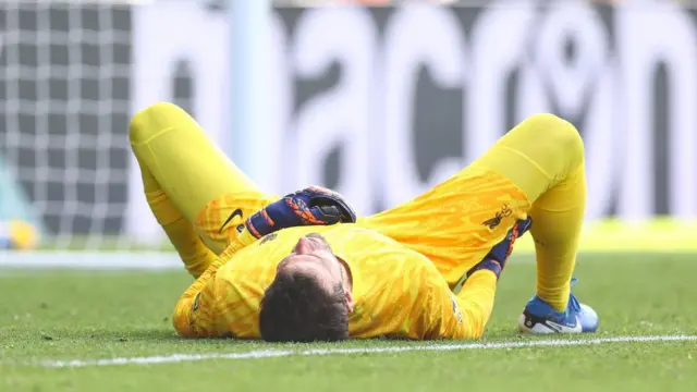 Liverpool goalkeeper Alisson Becker goes down injured