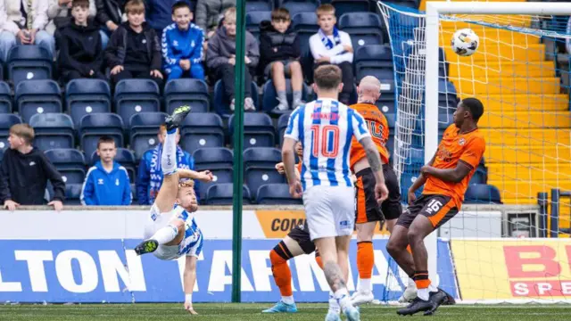 David Watson scores an overhead kick against Dundee United