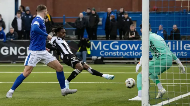 Toyosi Olusanya scores the opening goal of the game