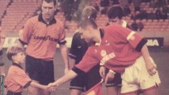 Wolves mascot Russell Penn, aged eight, shakes hands with Barnsley captain Neil Redfearn in 1993