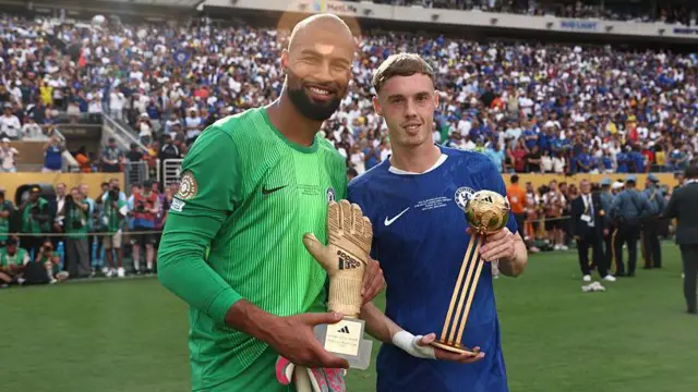Robert Sanchez and Cole Palmer holding their Golden Glove and Golden Ball awards