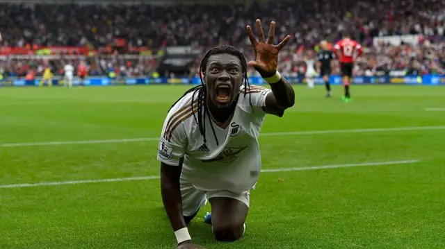 Bafetimbi Gomis celebrates a goal for Swansea City against Manchester United by imitating a panther