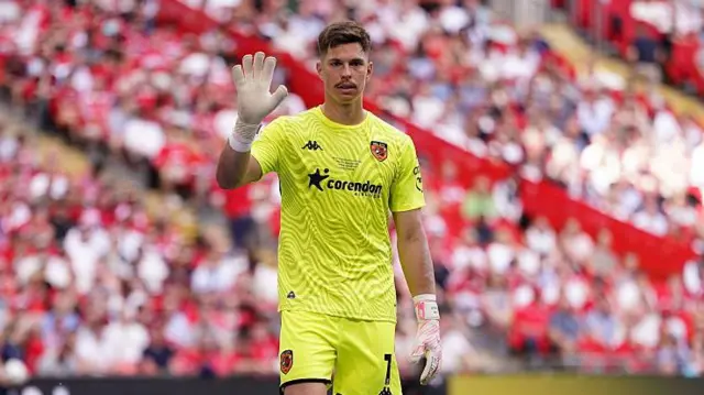 Ivor Pandur with his hand raised