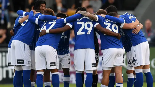 Cardiff players in a huddle earlier this season 