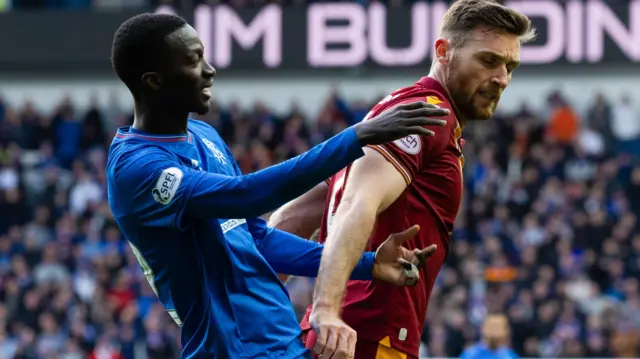 Rangers' Mohamed Diomande (L) and Motherwell's Stephen O'Donnell 